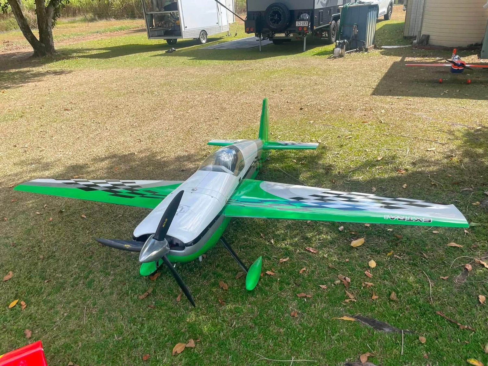 Green and White Extra Aerobatic Aircraft
